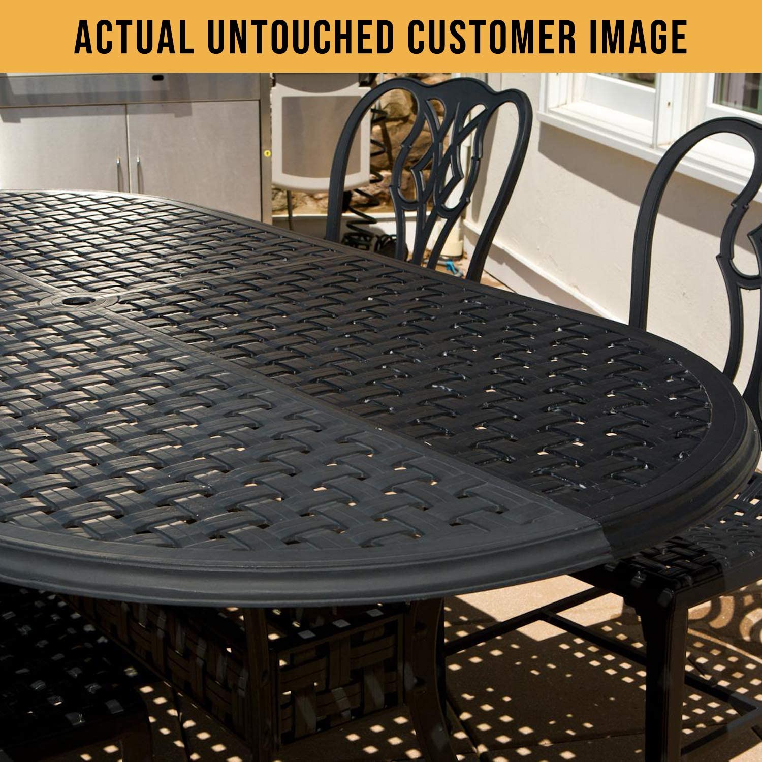 A close-up view of a black, woven outdoor dining table and matching chairs, showcasing intricate designs in sunlight.