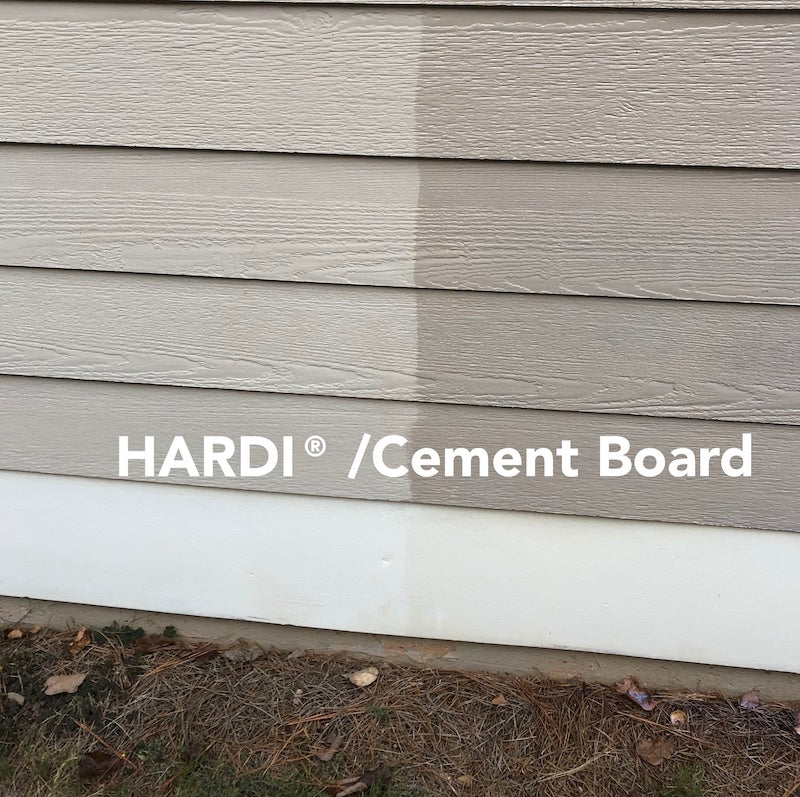 Close-up of a house exterior showcasing two-tone cement board siding, with one side lighter and labeled "HARDI® / Cement Board."