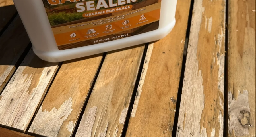 Acrylic sealer peeling off of wood deck. Toxic wood sealer with chemicals can be dangerous for gardens and home use.