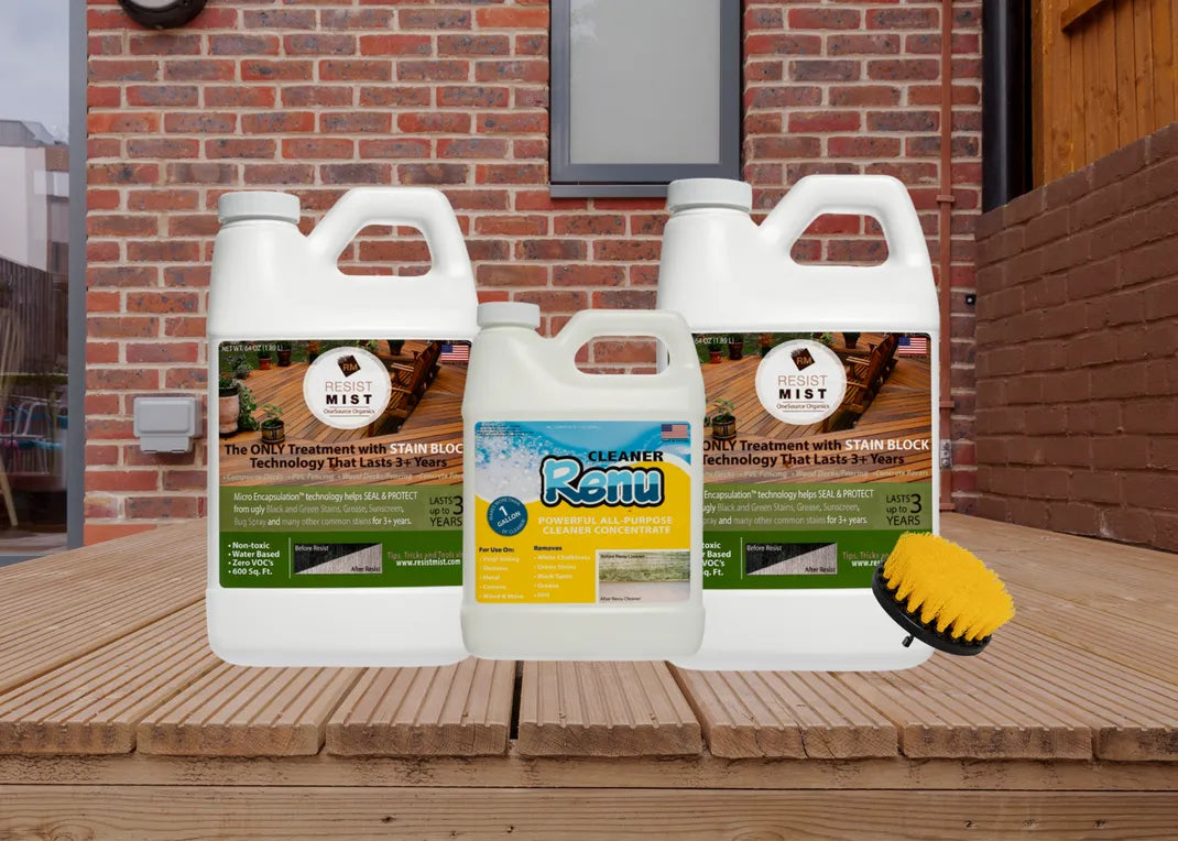 Three containers of cleaning solutions, including Resist Mist and Renu, with a scrub brush, displayed on wooden decking against a brick wall.