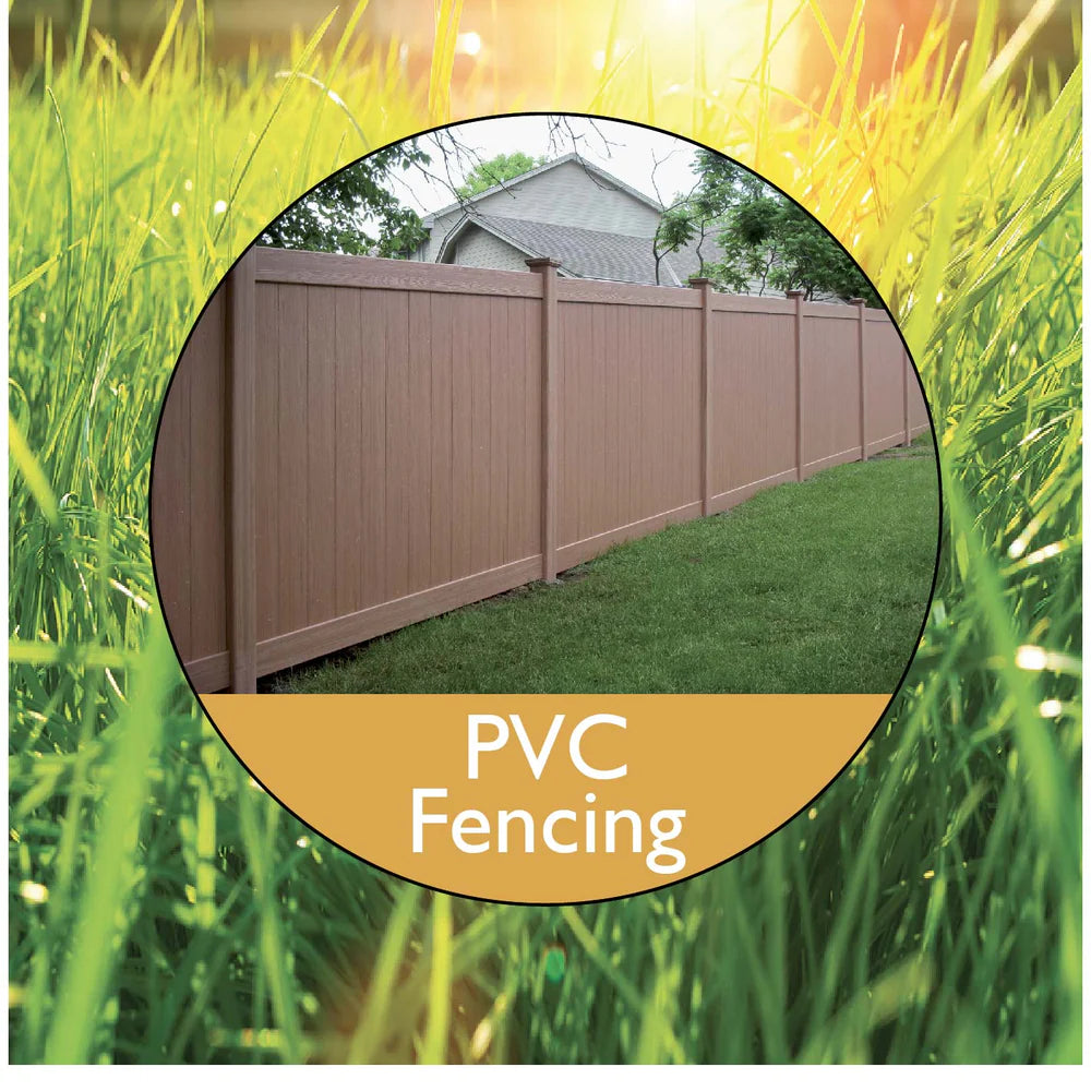 A well-maintained PVC fence surrounds a green lawn, with sunlight filtering through trees in the background, emphasizing durability and style.