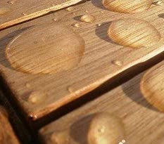 Bamboo decks with water droplets protected with Seal It Green Bamboo Armor Plant Based Wood Sealer